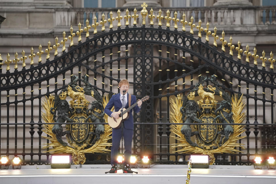 Ed Sheeran performs during the Platinum Jubilee Pageant outside Buckingham Palace in London, Sunday June 5, 2022, on the last of four days of celebrations to mark the Platinum Jubilee. The pageant will be a carnival procession up The Mall featuring giant puppets and celebrities that will depict key moments from the Queen Elizabeth II’s seven decades on the throne. (Jonathan Brady/Pool Photo via AP)