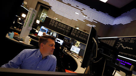 A share trader checks his screens at the stock exchange in Frankfurt, Germany October 2, 2017. REUTERS/Kai Pfaffenbach