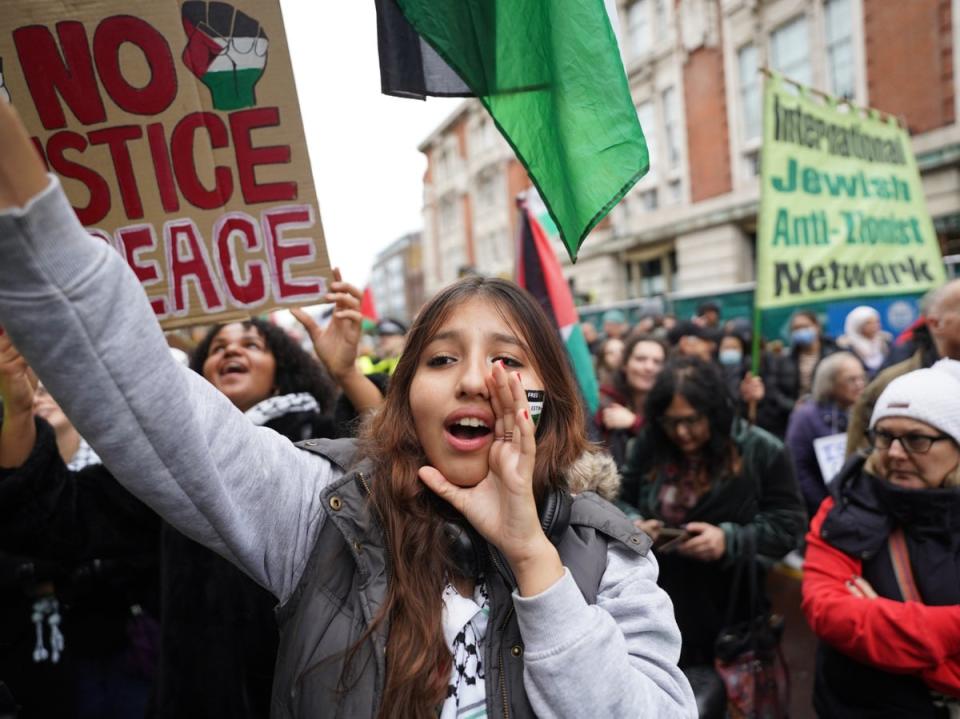 People demonstrate outside Keir Starmer’s constituency office on Saturday (PA)