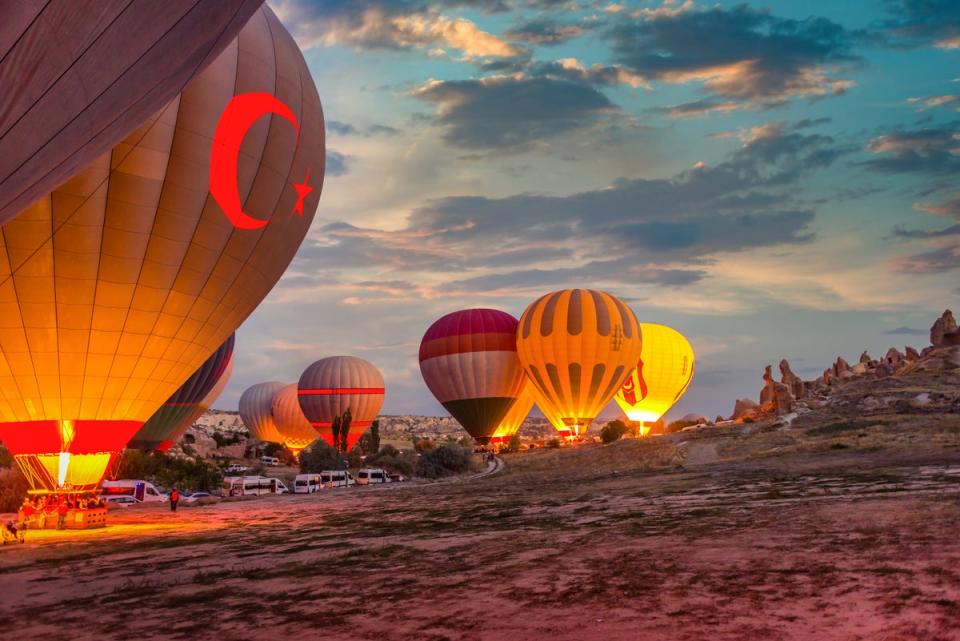 Hot air balloons in Cappadocia, Turkey launch at sunrise (Getty Images/iStockphoto)