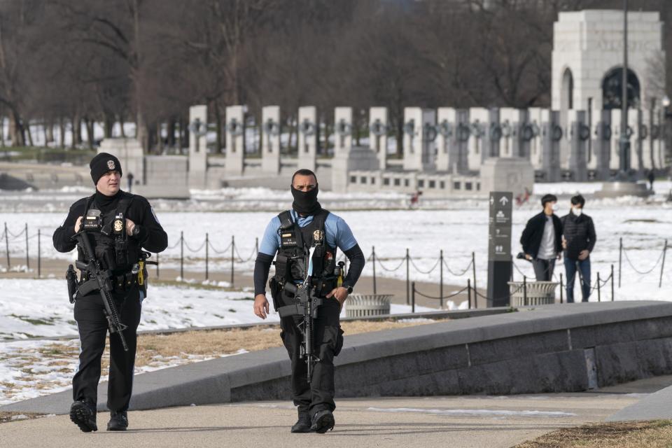 A year after the attack on the U.S. Capitol, U.S. Park Police patrol along the National Mall, with the WWII Memorial in the background, Thursday, Jan. 6, 2022, in Washington. Thursday marks the first anniversary of the Capitol insurrection, a violent attack that has fundamentally changed Congress and prompted widespread concerns about the future of American democracy. (AP Photo/Jacquelyn Martin)