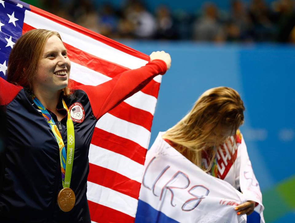 Lilly King of the United States celebrates as silver medalist Yulia Efimova of Russia looks on during the medal ceremony for the Women's 100m Breaststroke at the Rio 2016 Olympic Games.  (Clive Rose/Getty Images)