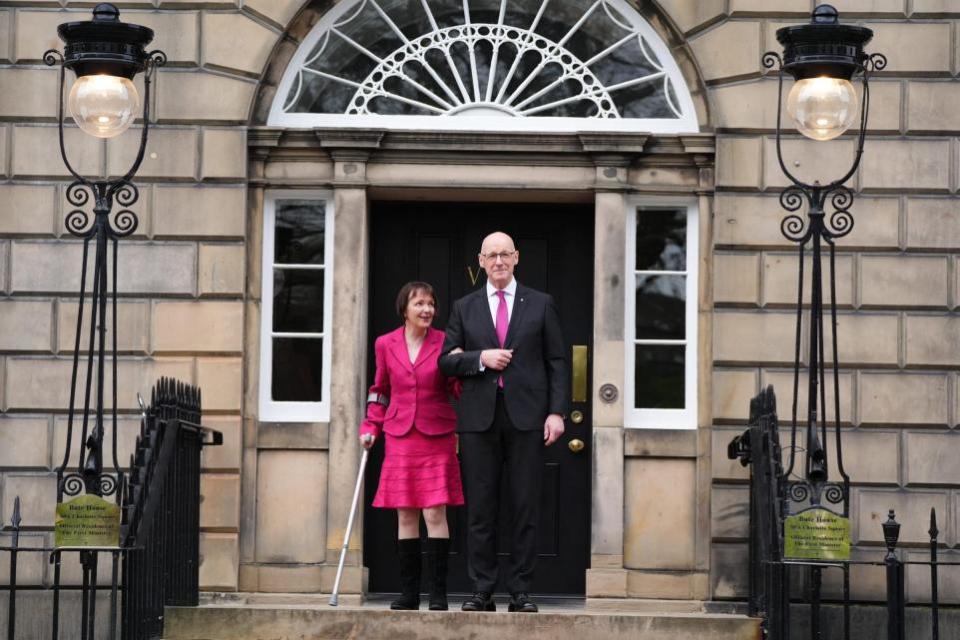 The Herald: John Swinney with his wife Elizabeth Quigley on the steps of Bute House in Edinburgh