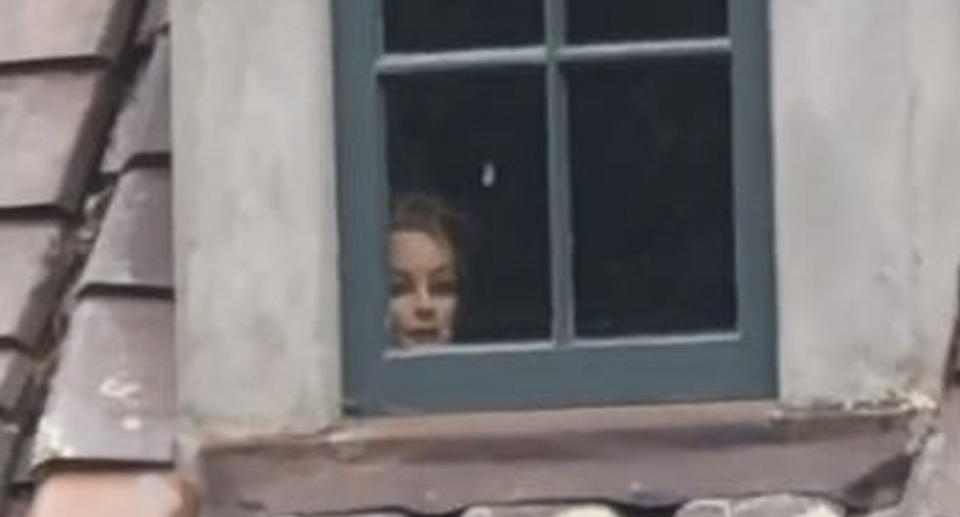 A mannequin head is seen in the window of a home in Carmel, California.