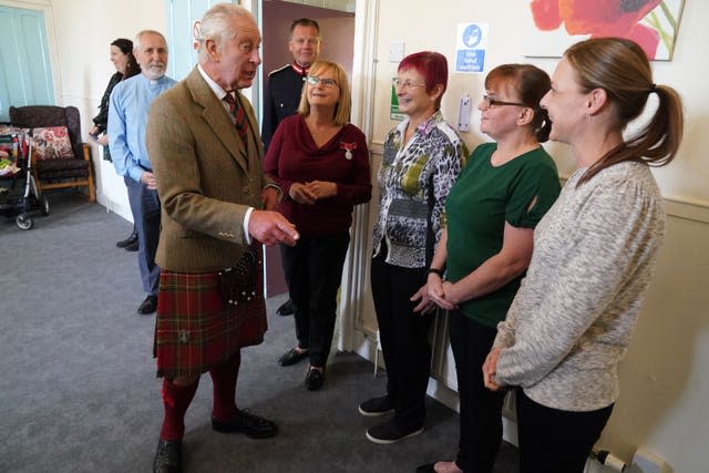 Charles meets charity voluntees