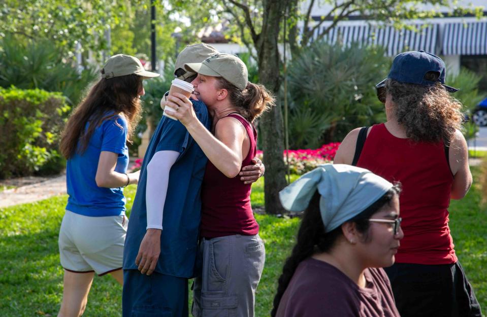 Marley Monacello hugs a friend in Bradley Park on Sunday.