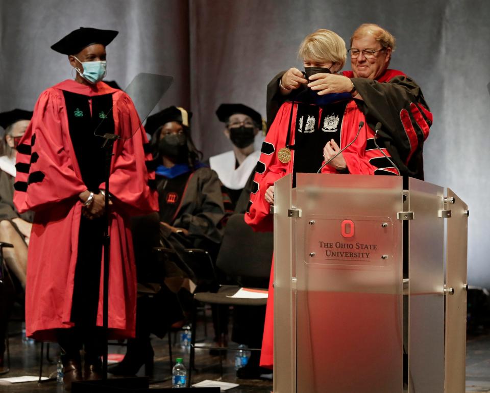 Ohio State President Dr. Kristina M. Johnson, Ph.D., is given the oath of office by Gary Heminger, Chair of the Ohio State University Board of Trustees, during her invesiture as the university's 16th president on Friday, November 19, 2021, in the Wexner Center for the Arts' Mershon Auditorium on campus in Columbus, Oh.