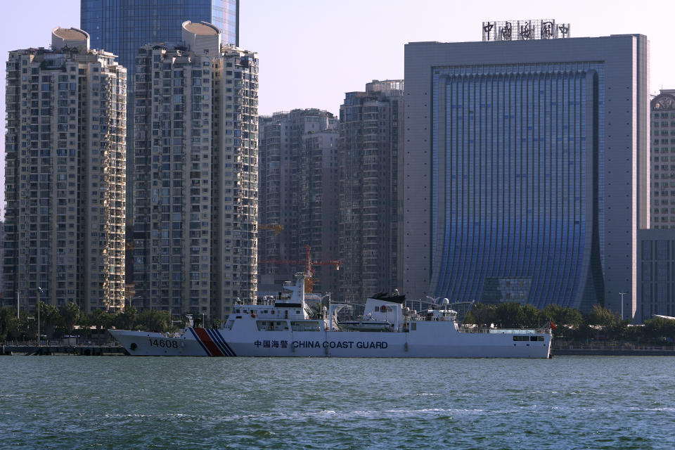 A Chinese Coast Guard ship is docked near a China Customs building in Xiamen in southeast China's Fujian province on Dec. 26, 2023. Taiwan on Tuesday, Feb. 20, 2024 protested China's boarding of a tourist boat, as tensions rise around the Kinmen archipelago, which lies a short distance off China's coast but is controlled by Taiwan. (AP Photo/Andy Wong)