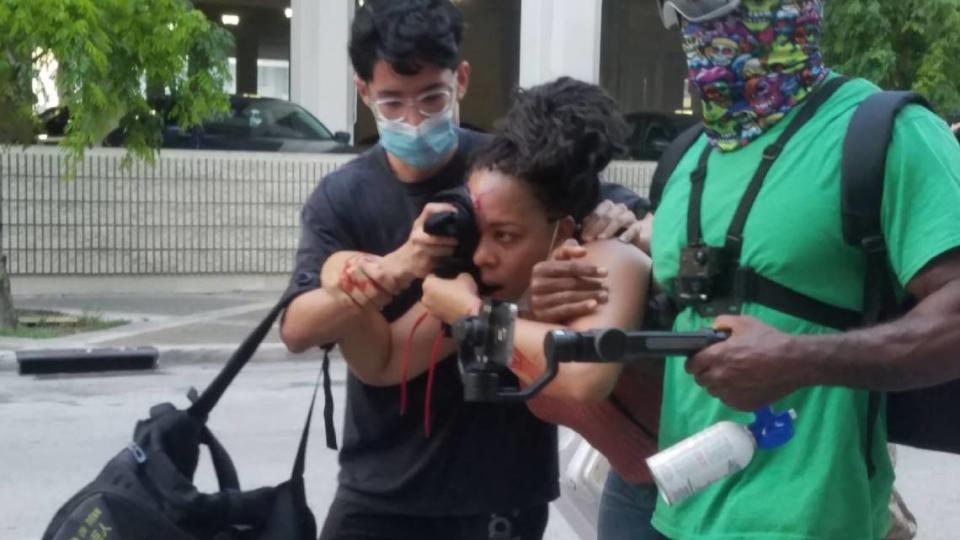 After a police officer shot LaToya Ratlieff in the face with a foam rubber bullet as she stumbled away from tear gas, other protesters rushed to the aid of the bleeding woman.