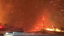 Wildfires are seen from a highway in Ojai, California, U.S. December 7, 2017 in this picture obtained from social media. INSTAGRAM @EPN106 via REUTERS