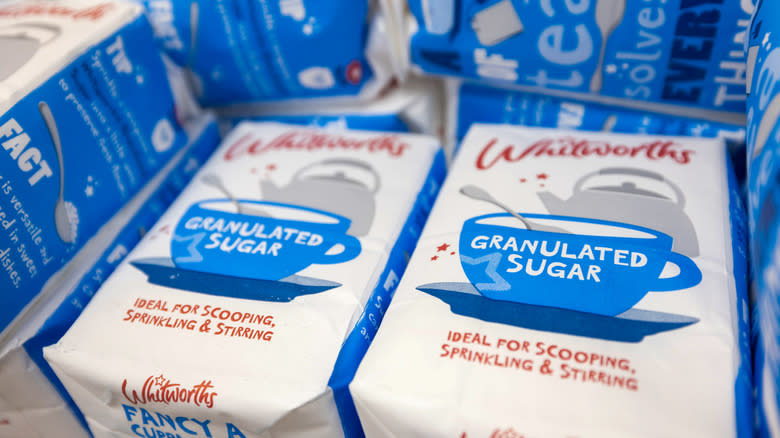 Child pouring white sugar