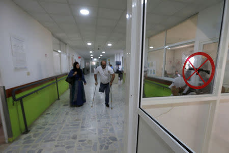 A man, who was wounded in Syria, walks inside a hospital in Tripoli, Lebanon May 23, 2017. Picture taken May 23, 2017.REUTERS/Mohamed Azakir