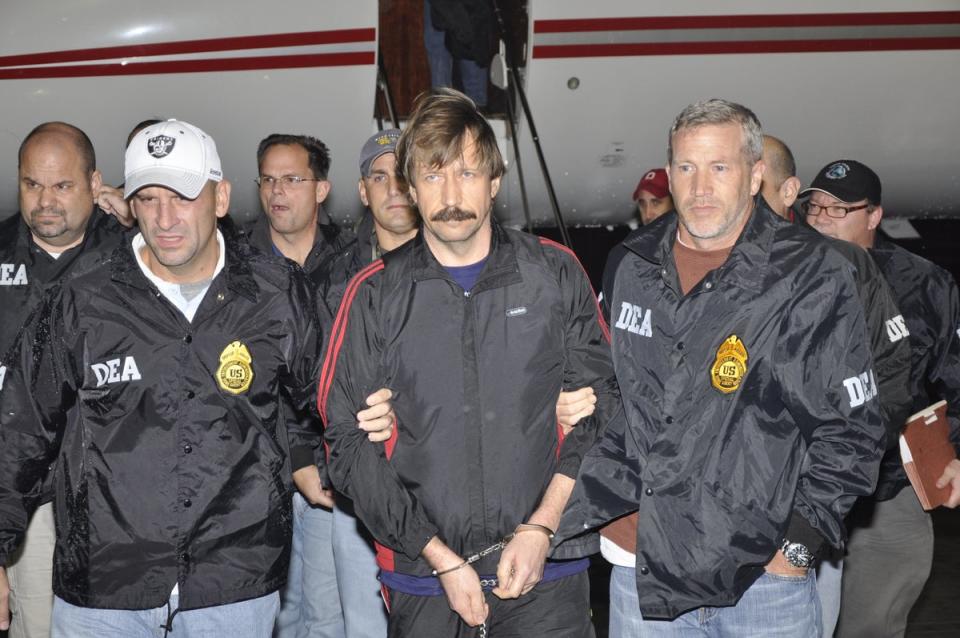 In this photo provided by the U.S. Department of Justice, former Soviet military officer and arms trafficking suspect Viktor Bout (C) deplanes after arriving at Westchester County Airport November 16, 2010 in White Plains, New York (Getty Images)