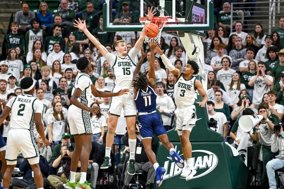 Michigan State's Carson Cooper, left, and Jaden Akins, right, block a shot by Georgia Southern's Jamar Franklin during the first half on Tuesday, Nov. 28, 2023, at the Breslin Center in East Lansing.