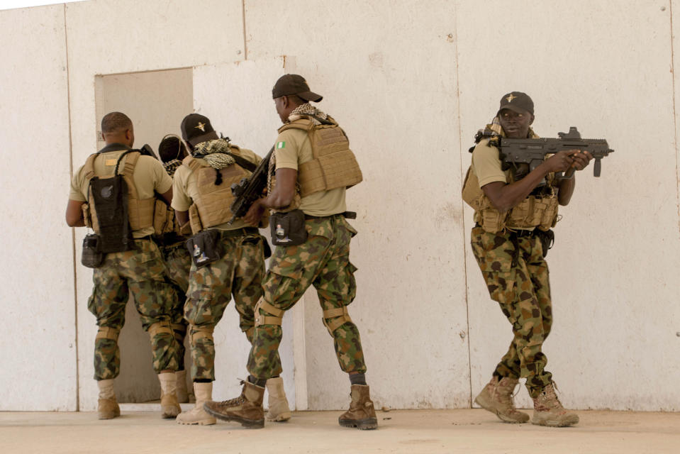 In this Tuesday Feb. 18, 2020, photo, Nigerian Navy Special Boat Service troops exercise under the supervision of British special forces during U.S. military-led annual counterterrorism exercise in Thies, Senegal. More than 1,500 service members from the armies of 34 African and partner training nations have assembled for the Flintlock exercises in Senegal and Mauritania, the two countries in West Africa's sprawling Sahel region that so far have not been hit by violence from extremists linked to al-Qaida or the Islamic State group. (AP Photo/Cheikh A.T Sy)