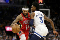 New Orleans Pelicans forward Brandon Ingram (14) drives against Minnesota Timberwolves forward Jaden McDaniels (3) in the first half of an NBA basketball game, Monday, Oct. 25, 2021, in Minneapolis. (AP Photo/Andy Clayton-King)