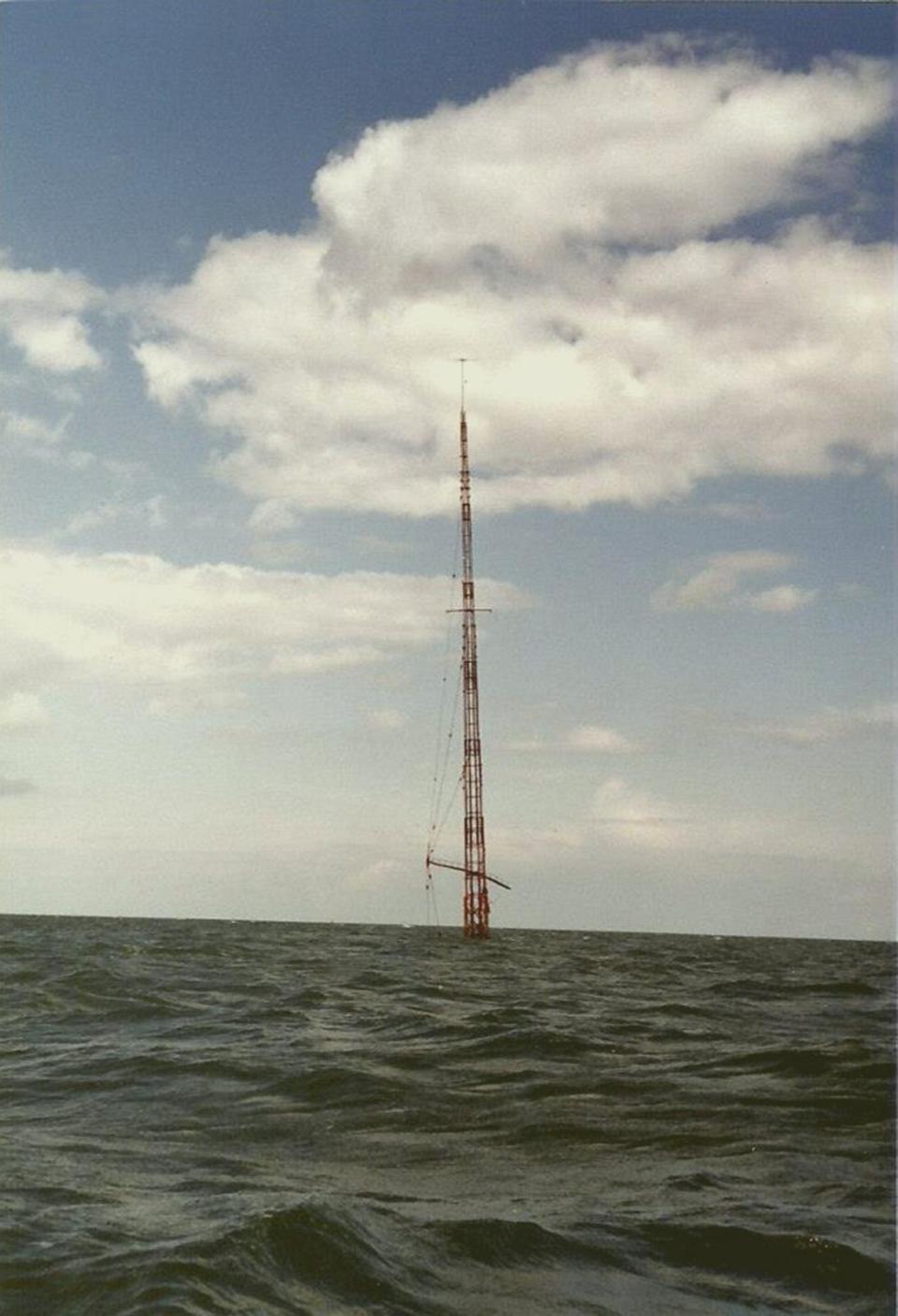 PHOTO: Caroline Mi Amigo Mast.  Caroline Mast sticking out the water in the North Sea after sinking in 1980.  (Offshore Echos Magazine)