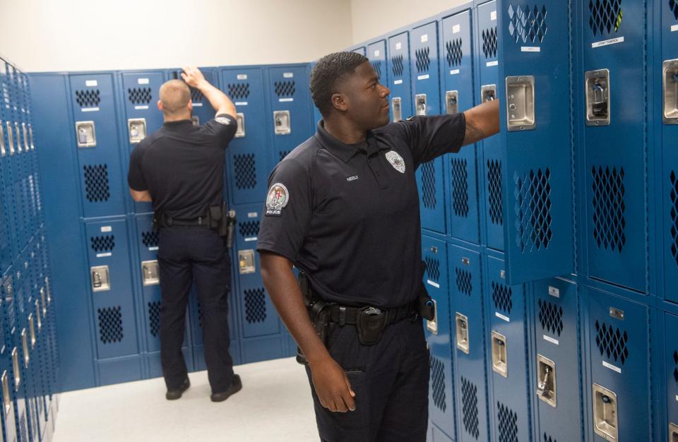 Newly hired Prattville Police officers Josiah Welch, left, and Trey Neely work at the Prattville Police Department in Prattville, Ala., on Tuesday, Nov. 14, 2023.