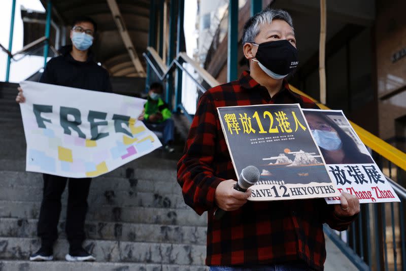 Pro-democracy supporters protest to urge for the release of 12 Hong Kong activists arrested as they reportedly sailed to Taiwan for political asylum and citizen journalist Zhang Zhan outside China's Liaison Office, in Hong Kong