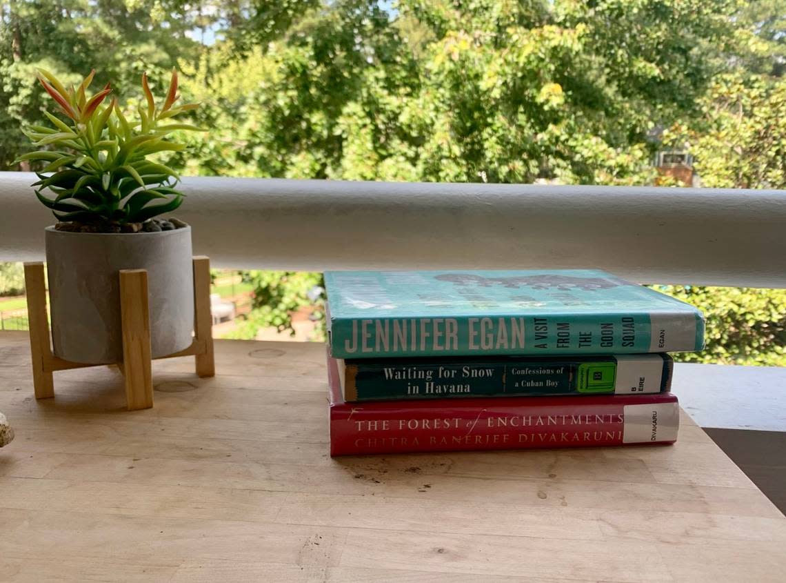 Picture of my books on my patio table.