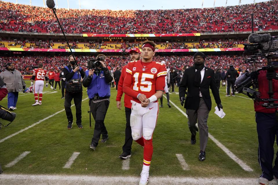 Kansas City Chiefs quarterback Patrick Mahomes (15) walks off the field at the end of the AFC championship NFL football game against the Cincinnati Bengals, Sunday, Jan. 30, 2022, in Kansas City, Mo. The Bengals won 27-24 overtime. (AP Photo/Ed Zurga)