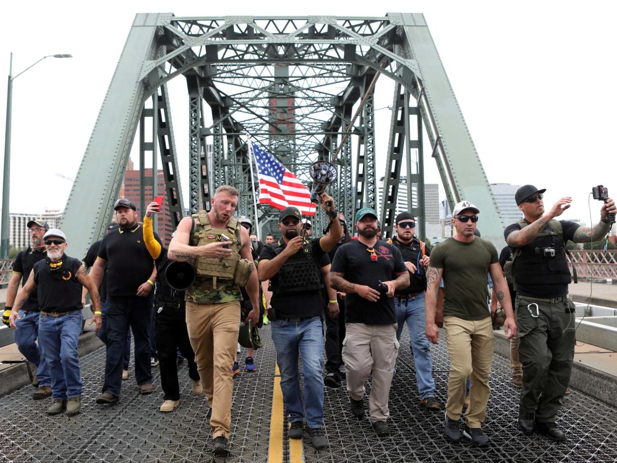 Proud Boys supporters now wearing 'Stand Back and Stand By' t-shirts (REUTERS)