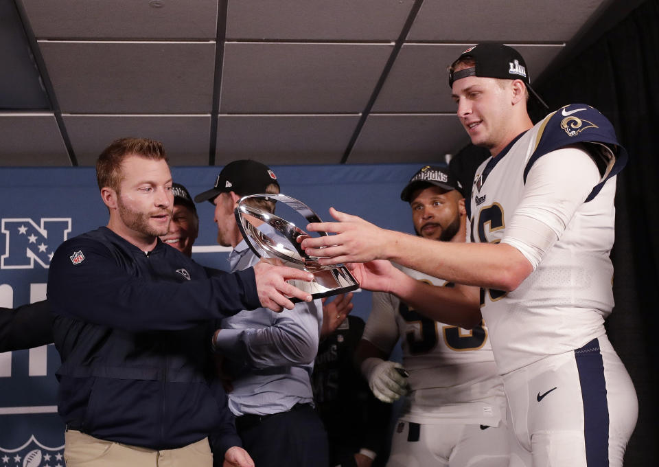Los Angeles Rams head coach Sean McVay and Los Angeles Rams quarterback Jared Goff hold the NFC Championship trophy after overtime of the NFL football NFC championship game against the New Orleans Saints, Sunday, Jan. 20, 2019, in New Orleans. The Rams won 26-23. (AP Photo/David J. Phillip)