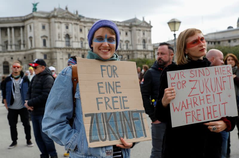 Demonstrators gather to protest against restrictions in Vienna