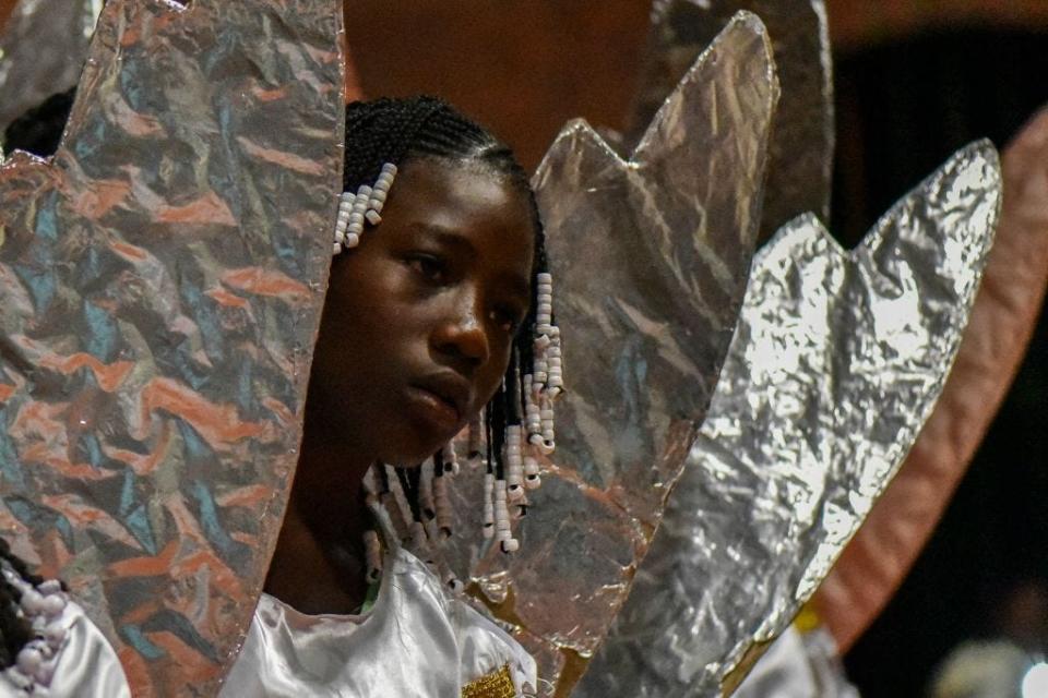 An Afro-Colombian girl in an angel constume takes part in the "Adoraciones al Nino Dios" celebrations in Quinamayo, department of Valle del Cauca, Colombia