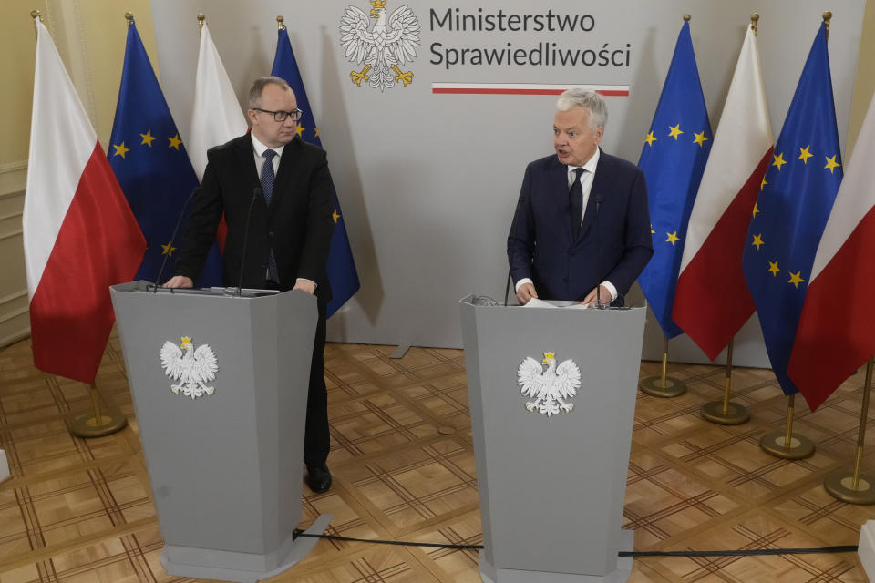 European Commissioner for Justice, Didier Reynders, right, and Poland's new Justice Minister Adam Bodnar take part in a news conference, in Warsaw, Poland, Friday Jan. 19, 2024. Reynders has praised efforts by Poland's new pro-EU government to restore rule of law and said they may lead to the release of some of EU funds for the country that were frozen under the previous recalcitrant administration. (AP Photo/Czarek Sokolowski)