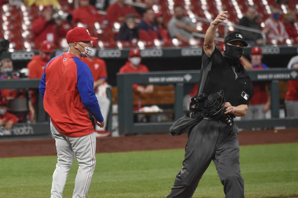 Philadelphia Phillies manager Joe Girardi, left, is ejected by umpire Chris Segal during the sixth inning of the team's baseball game against the St. Louis Cardinals on Wednesday, April 28, 2021, in St. Louis. (AP Photo/Joe Puetz)