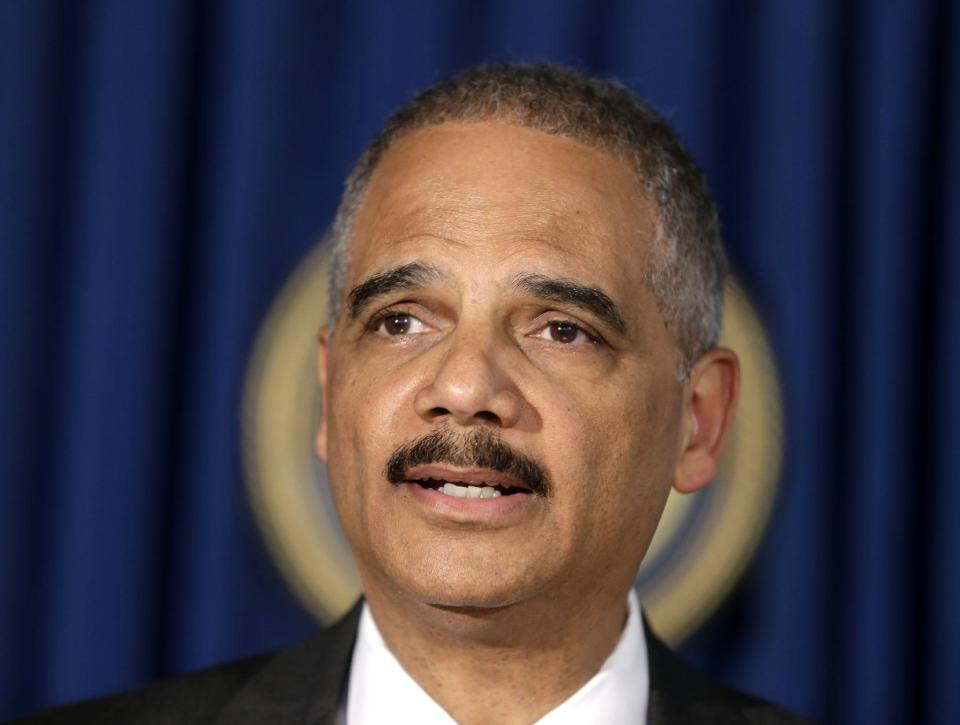 U.S. Attorney General Eric Holder speaks during a news conference in New York, Tuesday, April 1, 2014. Holder says the successful prosecution of Osama bin Laden's son-in-law in New York shows terror trials can be safely held in the United States.(AP Photo/Seth Wenig)
