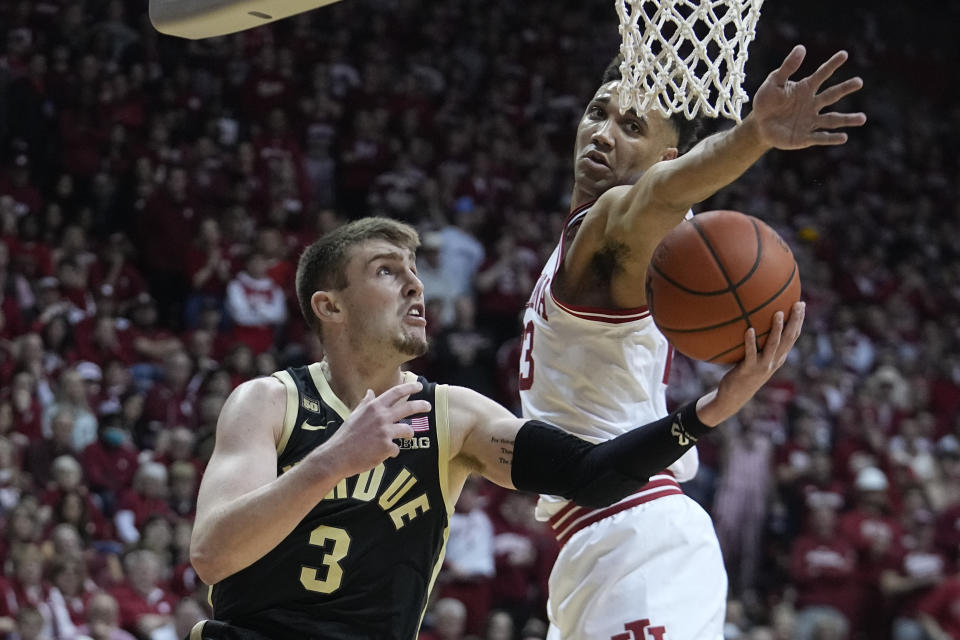 Purdue's Braden Smith (3) puts up a shot against Indiana's Trayce Jackson-Davis (23) during the first half of an NCAA college basketball game, Saturday, Feb. 4, 2023, in Bloomington, Ind. (AP Photo/Darron Cummings)
