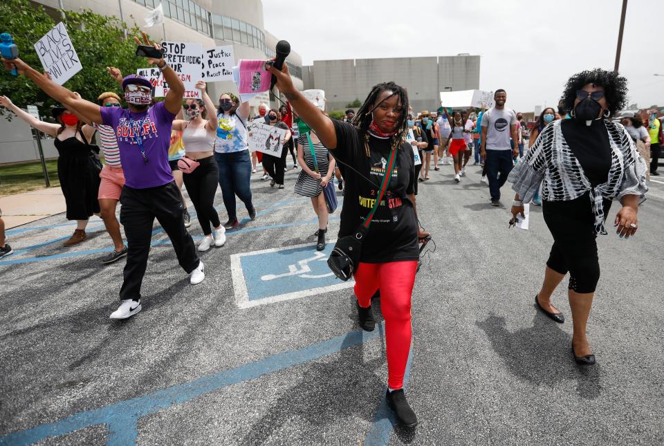 Mia  Jones, the president of United Community Change, leads hundreds of marchers during the Juneteenth Freedom Walk on Saturday, June 27, 2020.