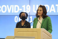 In this Monday, June 1, 2020, photo provided by the Michigan Office of the Governor, Michigan Gov. Gretchen Whitmer speaks during a news conference in Lansing, Mich. Whitmer lifted Michigan's nearly 10-week coronavirus stay-at-home order Monday, letting restaurants reopen to dine-in customers next week and immediately easing limits on outdoor gatherings while keeping social-distancing rules intact. (Michigan Office of the Governor via AP, Pool)