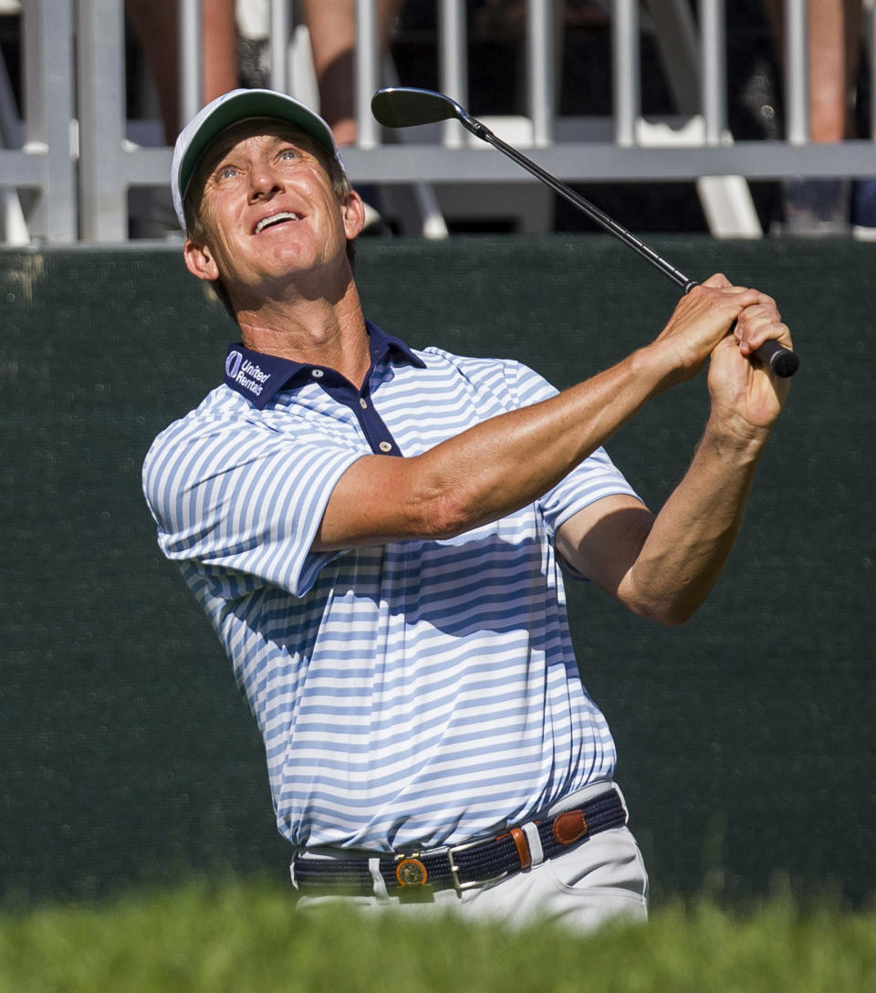 David Toms watches his shot from near the 12th green during the third round of the U.S. Senior Open golf tournament Saturday, June 29, 2019, at Warren Golf Course in South Bend, Ind. (Robert Franklin/South Bend Tribune via AP)