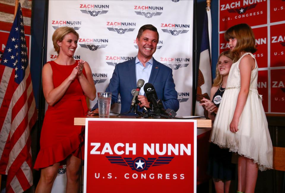 Iowa Sen. Zach Nunn is joined by his family as he delivers a victory speech at the Blue Shark Ale House in Urbandale, Iowa, after winning the U.S. Rep. District 3 Republican primary on Tuesday, Nov. 7, 2022. Nunn will face Democratic incumbent Cindy Axne in November. 