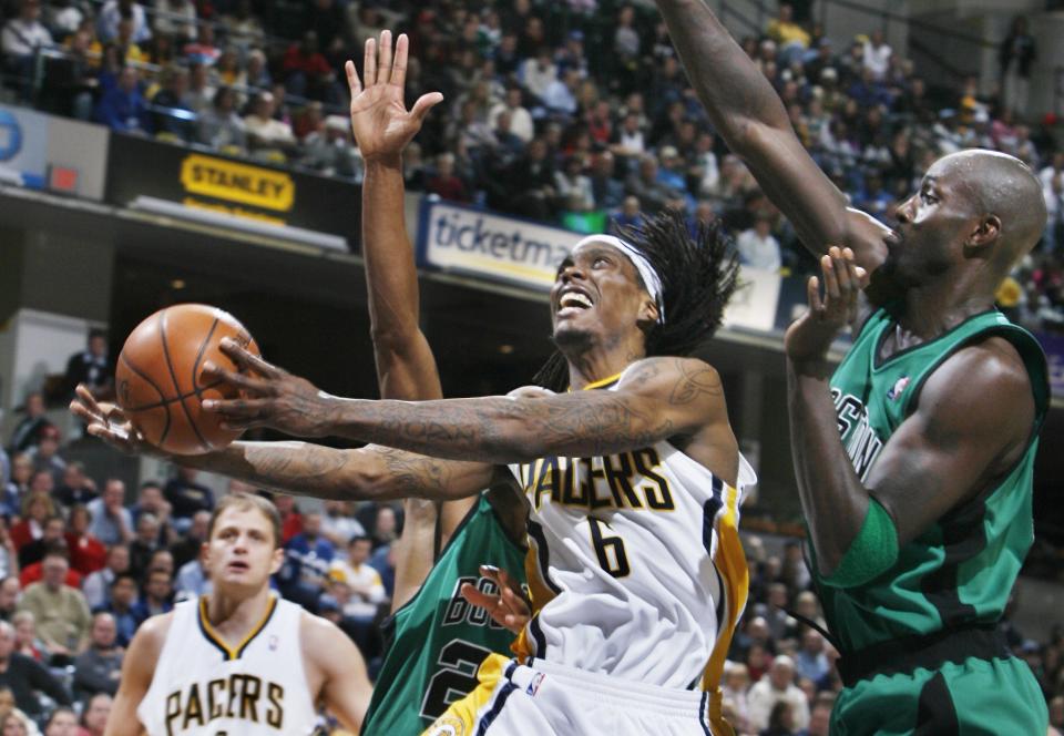 Marquis Daniels couldn't get this shot to fall in overtime. Defending is Kevin Garnett of Boston. The Pacers hosted the Celtics in an NBA game  Sunday 12/7/08 at Conseco Fieldhouse in Indianapolis. Rob Goebel/Indianapolis Star.