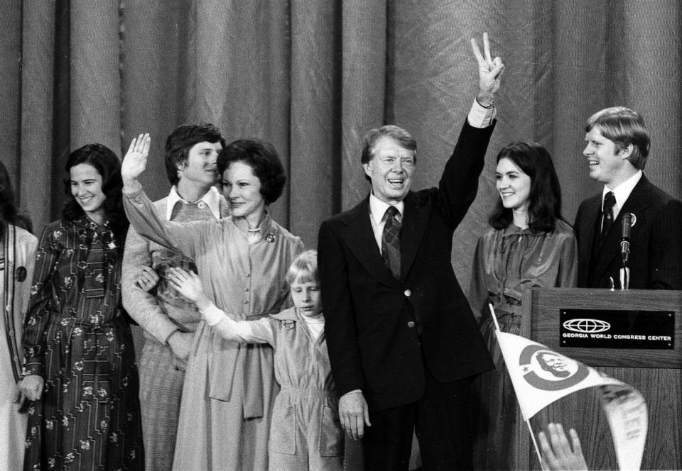 PHOTO: FILE - View of future First Lady Rosalynn Carter (fore left), daughter Amy, and husband, US President-Elect Jimmy Carter, as they wave, Atlanta, Nov. 3, 1976. (Consolidated News Pictures/Getty Images)