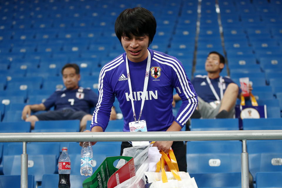 <p>Japan’s supporter picking up litter after their 2018 FIFA World Cup Round of 16 football match against Belgium at Rostov Arena Stadium. Team Belgium won the game 3:2. Valery Sharifulin/TASS (Photo by Valery Sharifulin\TASS via Getty Images) </p>