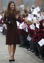 <p>On a visit to Grimsby, Kate recycled her £369 Hobbs coat from the previous year. She teamed the chestnut-hued number with a dress by London-based label, Great Plains. <em>[Photo: Getty]</em> </p>