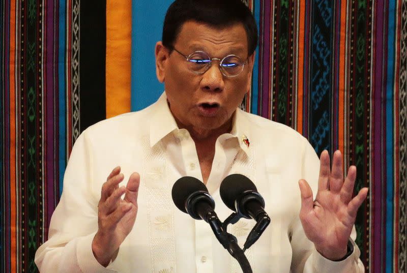 Philippine President Rodrigo Duterte gestures during his fourth State of the Nation Address at the Philippine Congress in Quezon City