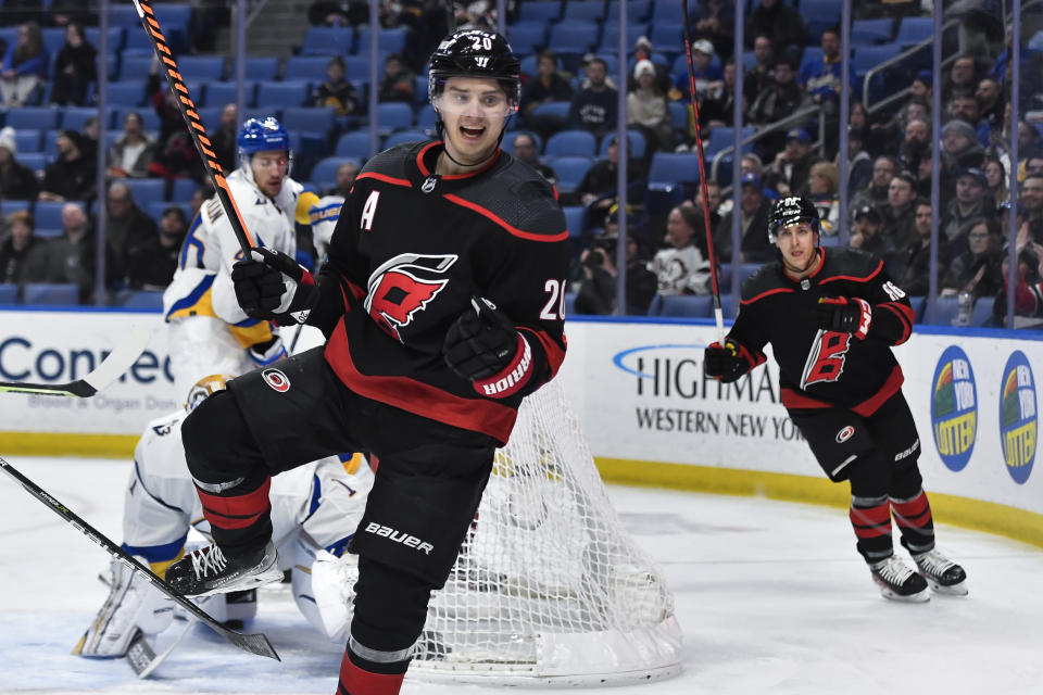 Carolina Hurricanes center Sebastian Aho (20) celebrates after scoring against the Buffalo Sabres during the first period of an NHL hockey game in Buffalo, N.Y., Wednesday, Feb. 1, 2023. (AP Photo/Adrian Kraus)