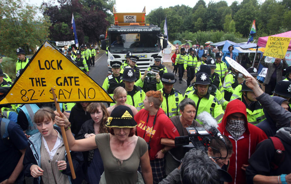 Protesters attempt to slow vehicles down that are arriving at the Balcombe fracking site in West Sussex as energy company Cuadrilla has started testing equipment ahead of exploratory oil drilling in the English countryside as anti-fracking protests at the site entered a ninth day.