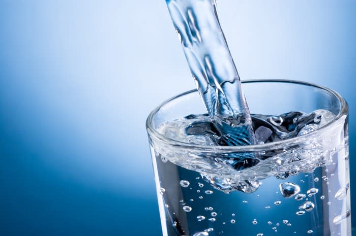 Close-up of water pouring into a glass.