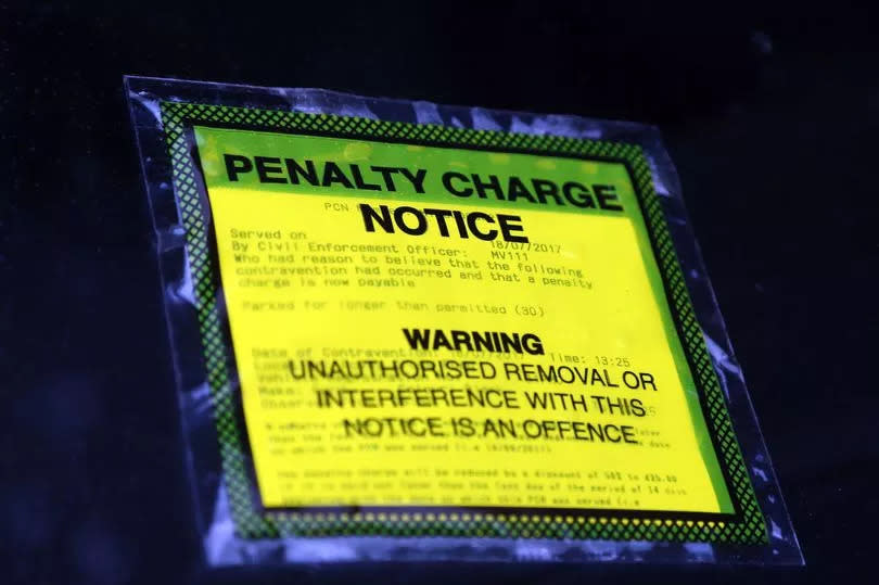 A penalty charge notice on a car