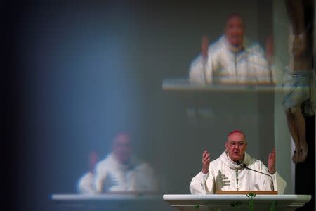 Dallas Bishop Kevin Farrell speaks during a prayer service at The Cathedral Shrine of the Virgin of Guadalupe following the multiple police shootings in Dallas, Texas, U.S., July 9, 2016. REUTERS/Carlo Allegri