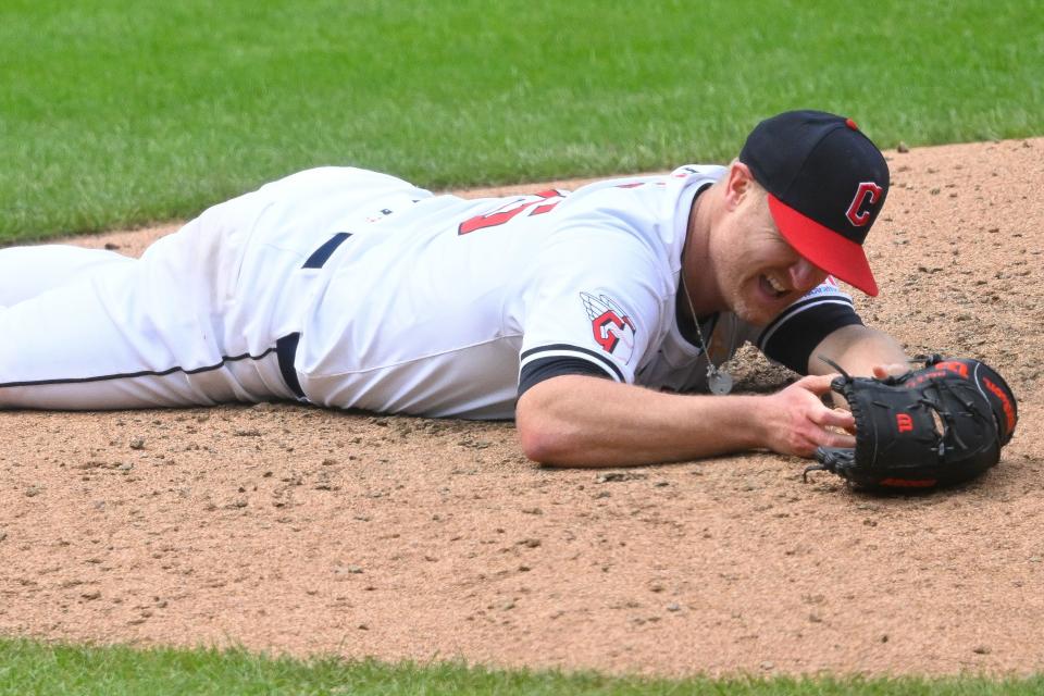 Cleveland Guardians starting pitcher Alex Cobb (35) reacts after he was struck by a batted ball resulting in a hit that broke up a perfect game in the seventh inning Sunday against the Pittsburgh Pirates in Cleveland.