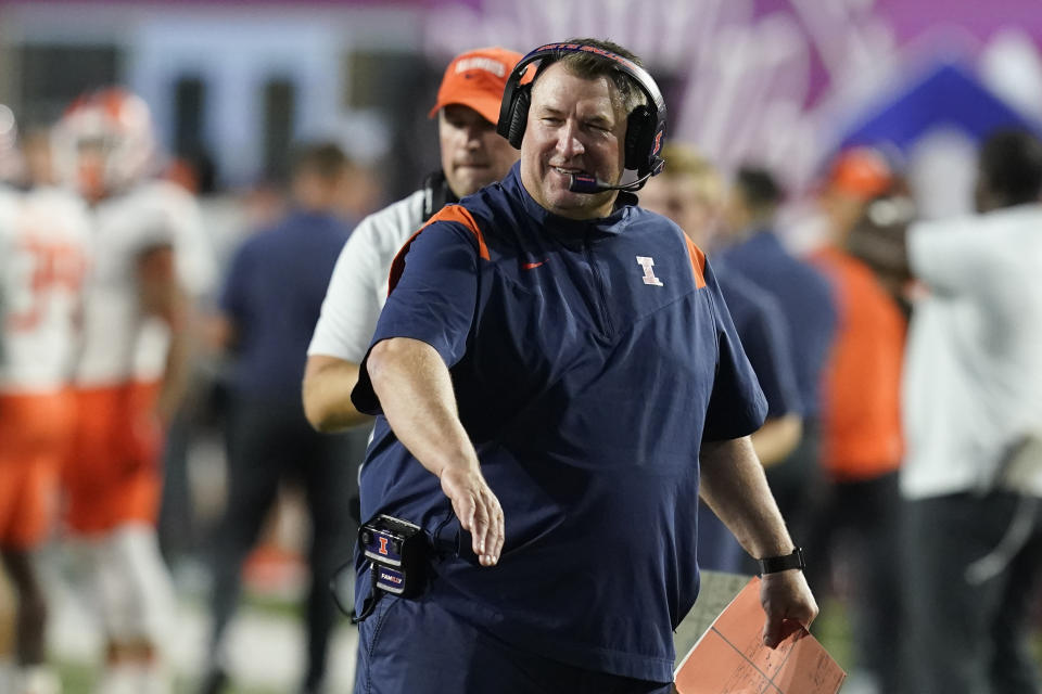 FILE - Illinois head coach Bret Bielema smiles after a touchdown during the first half of an NCAA college football game against Indiana, Friday, Sept. 2, 2022, in Bloomington, Ind. Less than two full years on the job, Bret Bielema and his Illinois football team are achieving at a rate not seen in the program in a long time. Bielema is the pick for top coach in the Associated Press Big Ten Midseason Awards, Tuesday, Oct. 11, 2022.(AP Photo/Darron Cummings, File)