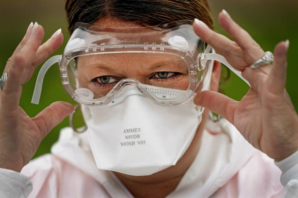 TEXAS: Nurse Yvette Laugere adjusts her safety goggles at a newly opened COVID-19 testing site in Sugar Land outside Houston on April 2.